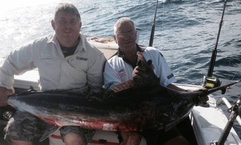 Ian with a Marlin he caught with the use of a Downrigger Shop Spreader Bar