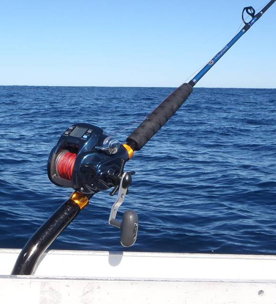 Fishing trolling boat rods in rod holder. Big game fishing