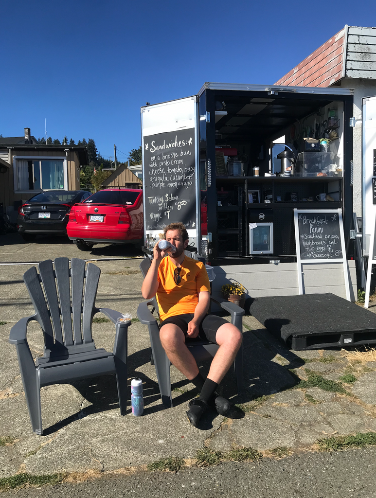 Man sitting at Bean There coffee truck on Vancouver Island
