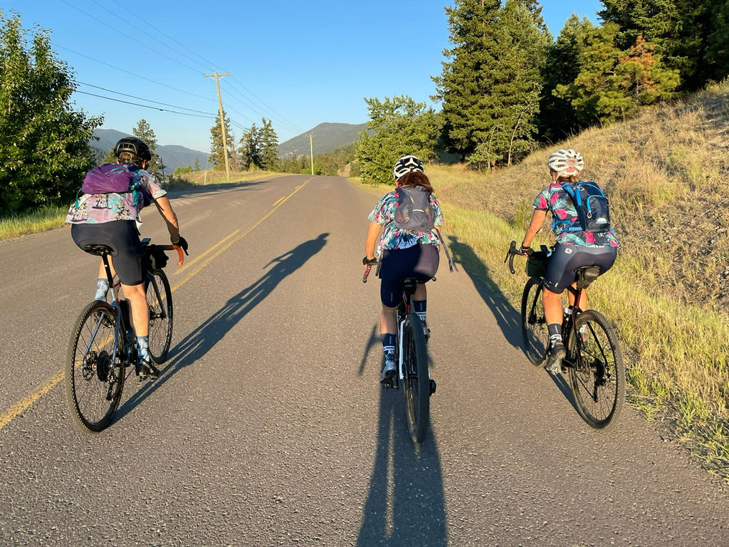 Three women riding outdoors wearing Samsara Cycle Kits