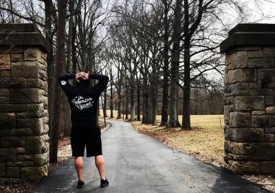 Andy standing at a gate