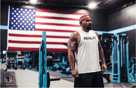 Andy standing in front of the American flag