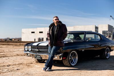 Andy standing in front of a Chevelle