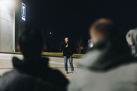 Andy speaking to a group outside