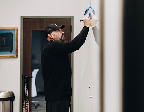 Andy writing on a board