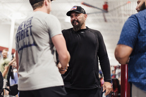 Andy Frisella shaking hands with someone