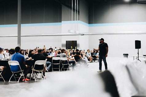 Andy Frisella speaking to a group