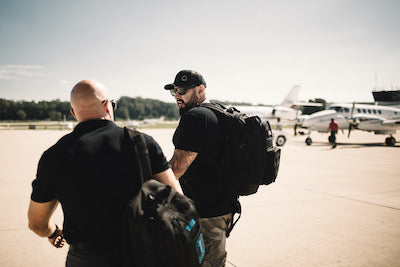 Andy walking through a private airport