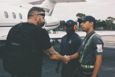 Andy shaking hands with an airline employee