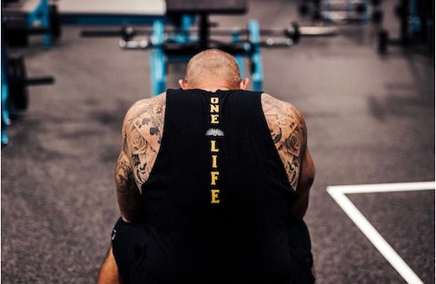 Andy sitting in the gym looking away