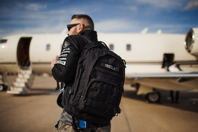 Andy walking to a plane