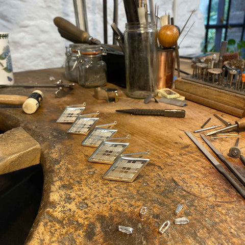 Lockets on jewellers bench, Matthew Vaughn's film Argylle