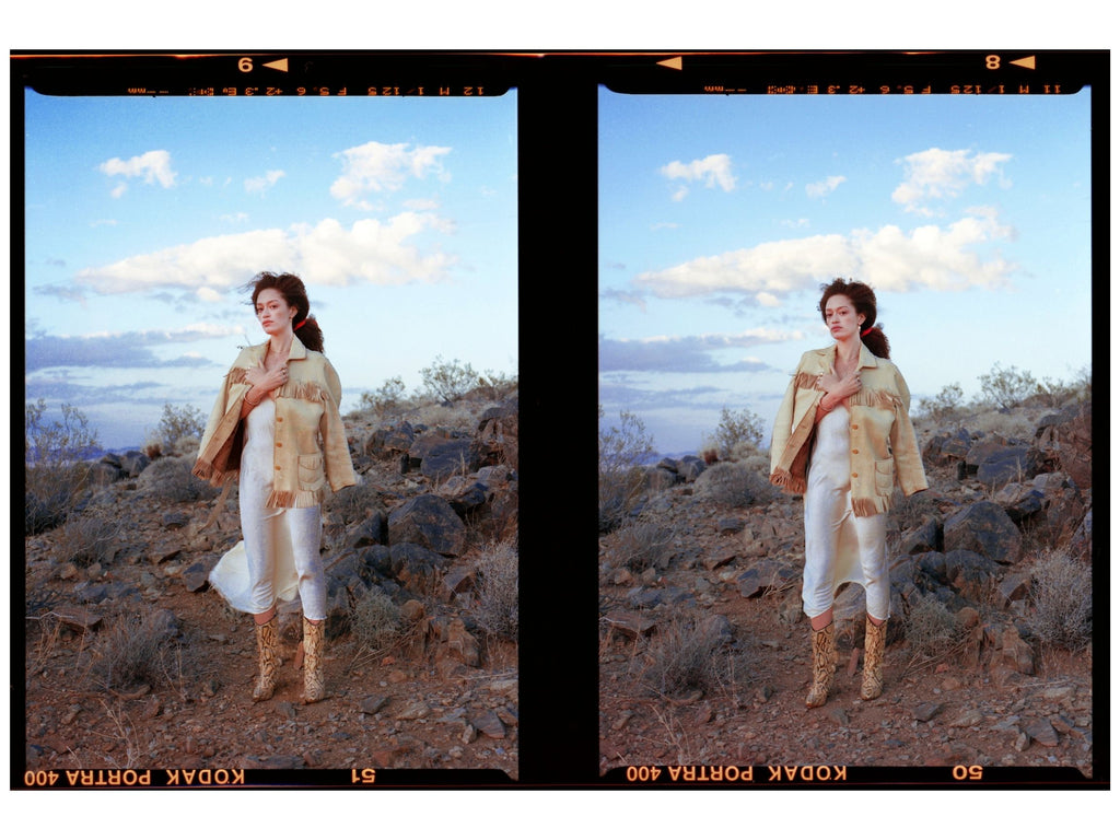 woman wearing vintage western style clothing in desert at sunset wearing erin cuff jewelry