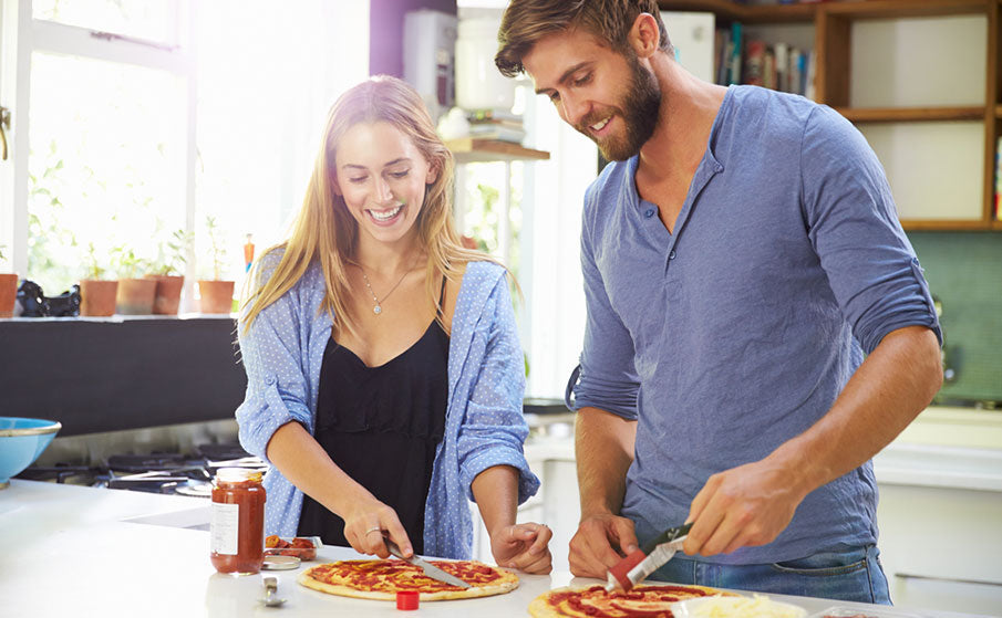 couple making pizza