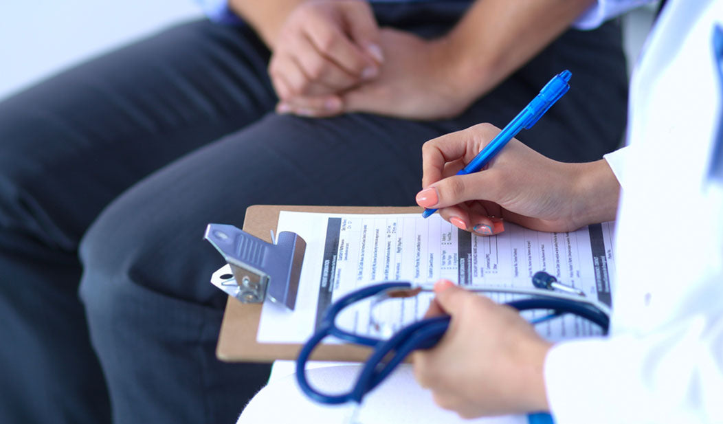 doctor reviewing charts with patient