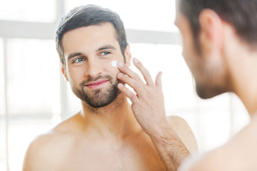 man applying cream