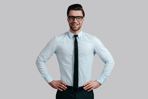 man wearing eyeglasses and business attire