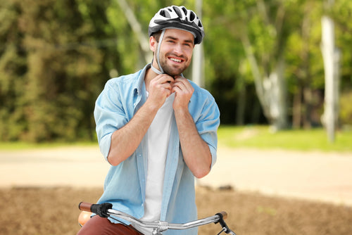 man putting helmet on