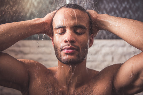 closeup of man taking shower