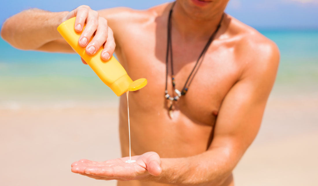 pouring sunscreen into hands