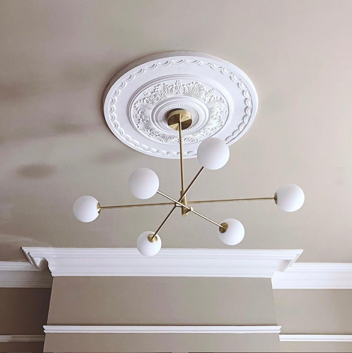 ceiling rose with modern light fitting