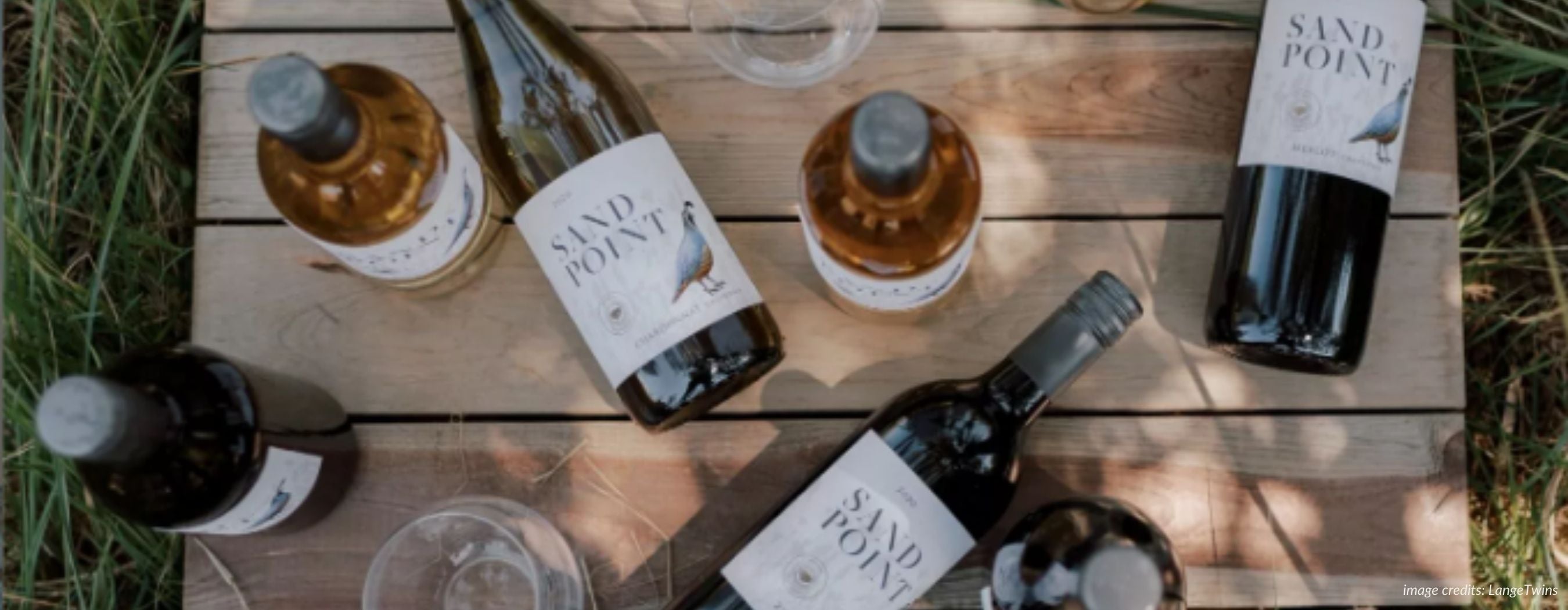sand point california wines on a wooden table flatlay