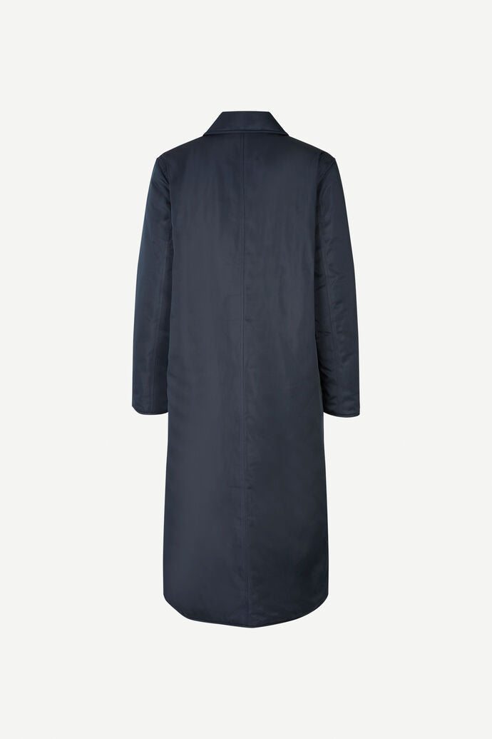Reverisble navy and black waterproof and windproof coat with quilted black lining and button fastenings