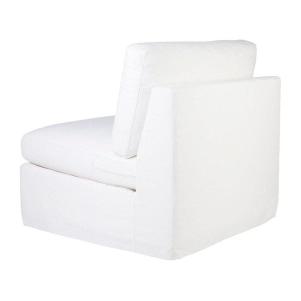 white slipcovered swivel chair