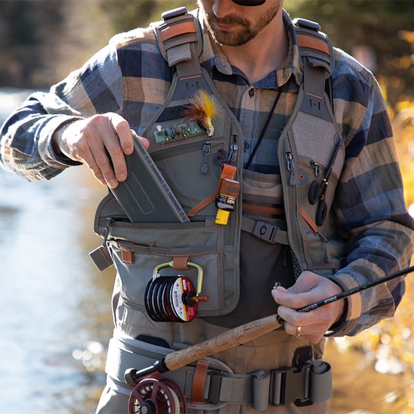 FHV-G 816332014970 Fishpond Flint Hills Fly Fishing Vest Front View With Fly Box Fishing On River