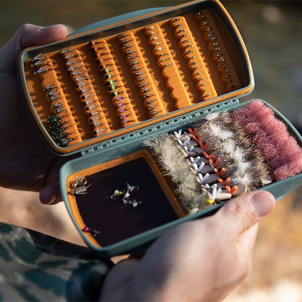 TPFB-M-SG 816332014871 Fishpond Tacky Pescador Fly Fishing Fly Box With MagPad And Silicone Slits Smoke Grey In The Wild Open With Flies Opt