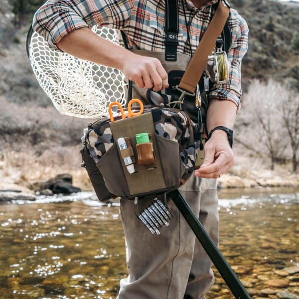 umpqua zs2 ledges 650 fly fishing waist pack camo on river in the wild