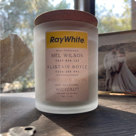 A soy candle jar with branding information on the label.