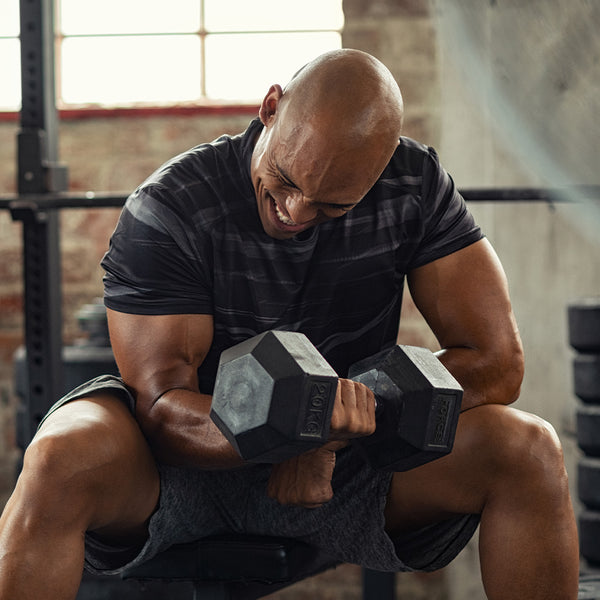 Man working out hex dumbbells