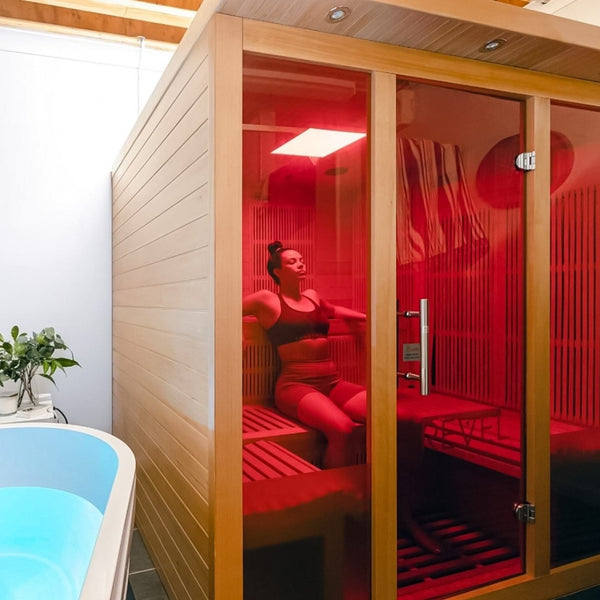 Woman sitting in infrared sauna