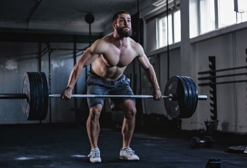 Lifting too heavy is a common workout mistakes people in the gym