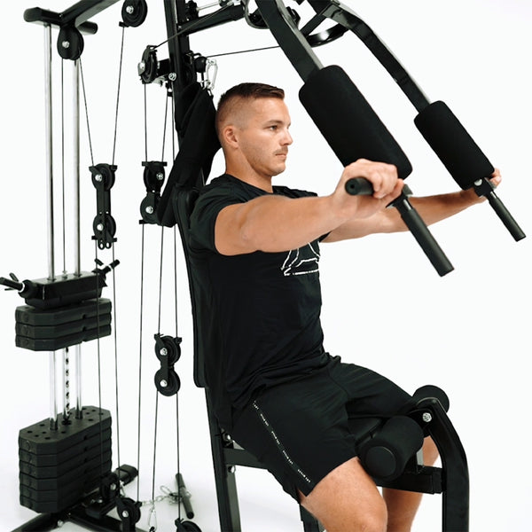 Man using Force USA HG100 Multigym