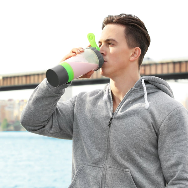 Man consuming a post-workout supplement outdoors