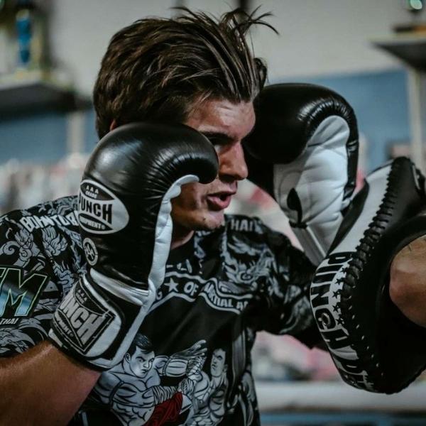 Man using Punch Fitness Boxing Gloves with Focus Pads