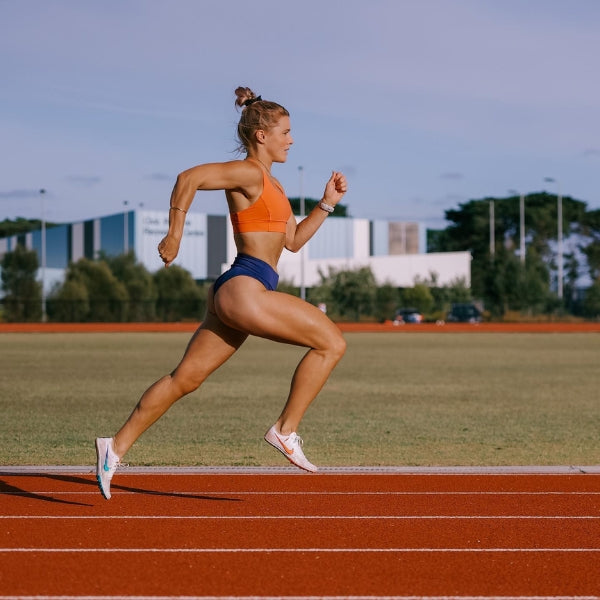 Lucy Young running at full stride on athletics track