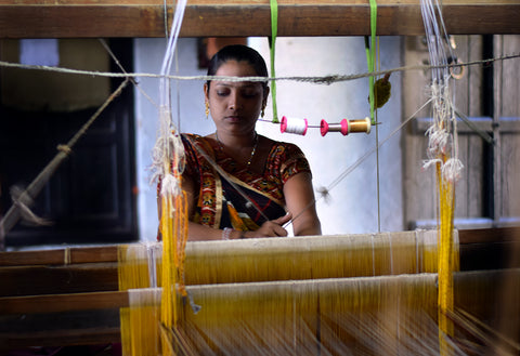 Woman weaving Handloom fabric - Maheshwar - India