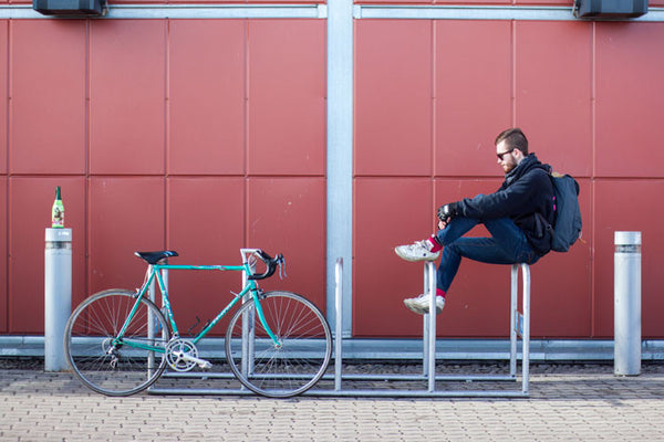 Man with a bag and bicycle