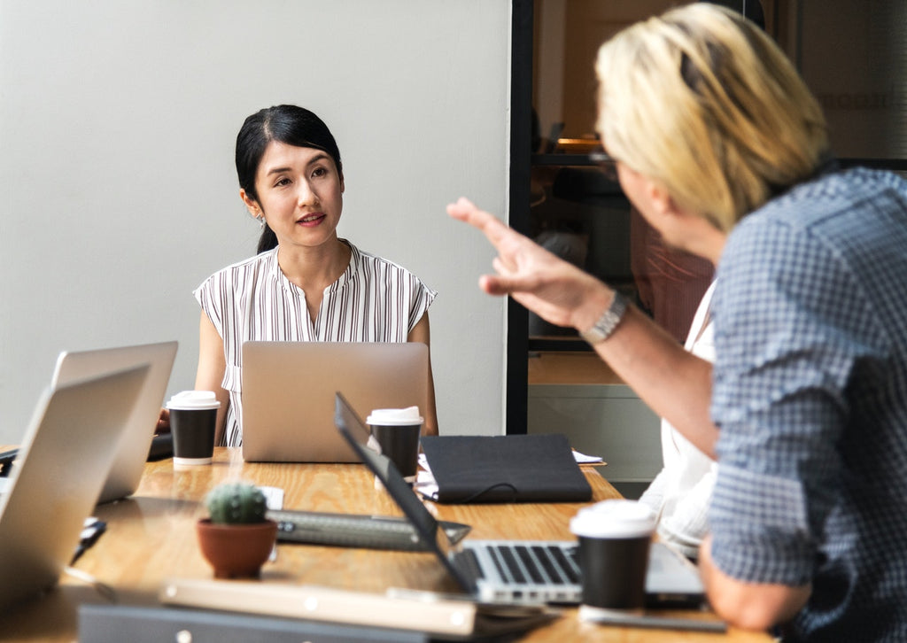 woman and man in office meeting