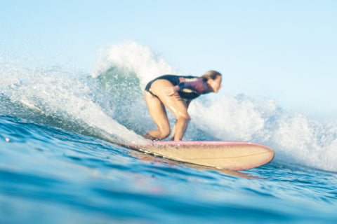 surfer girl on wave