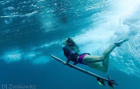 Surfer girl duck dive