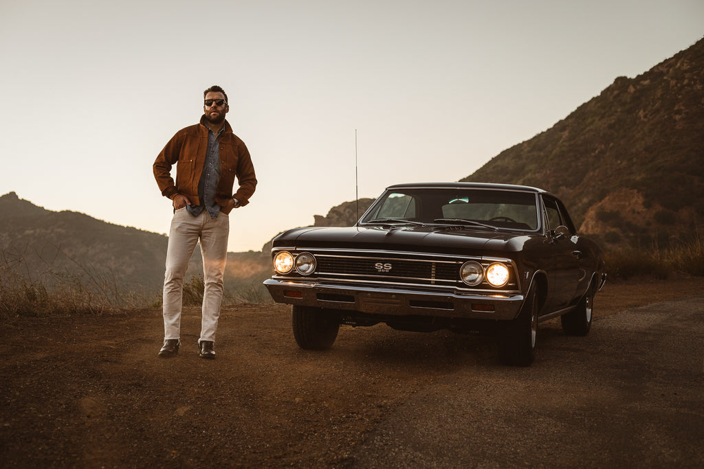 Two Pocket Ranch Jacket Standing next to a muscle car