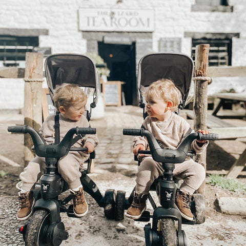 Two twins in the Liki Trike S1 side by side