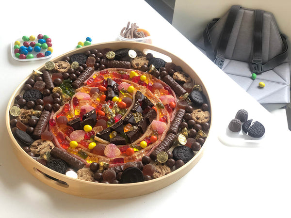 Candy Tray shaped like a pumpkin next to Pop-Up Booster