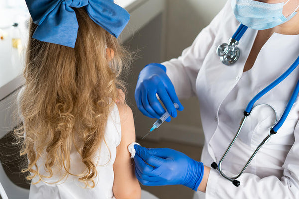 Girl getting a vaccination shot