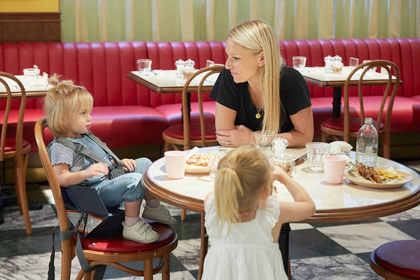 Mom with toddlers in restaurant