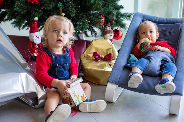 Kids on Bamboo 3DKnit Bouncer in front of Christmas tree